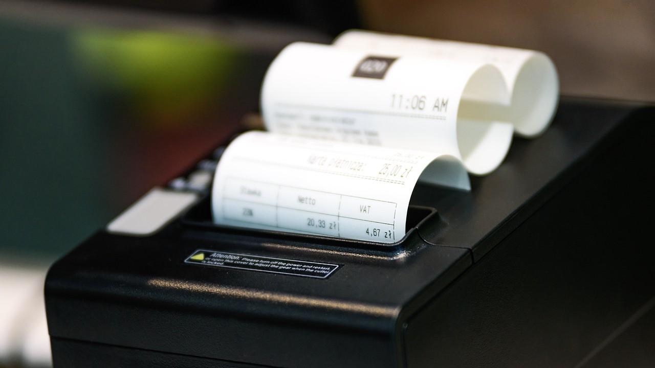 A receipt coming out of a printer