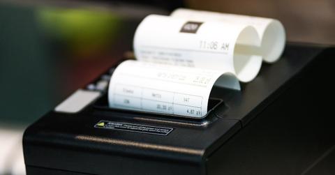 A receipt coming out of a printer