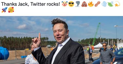 Composite image of Elon Musk pointing up at a tweet he wrote that reads "Thanks Jack, Twitter rocks!"