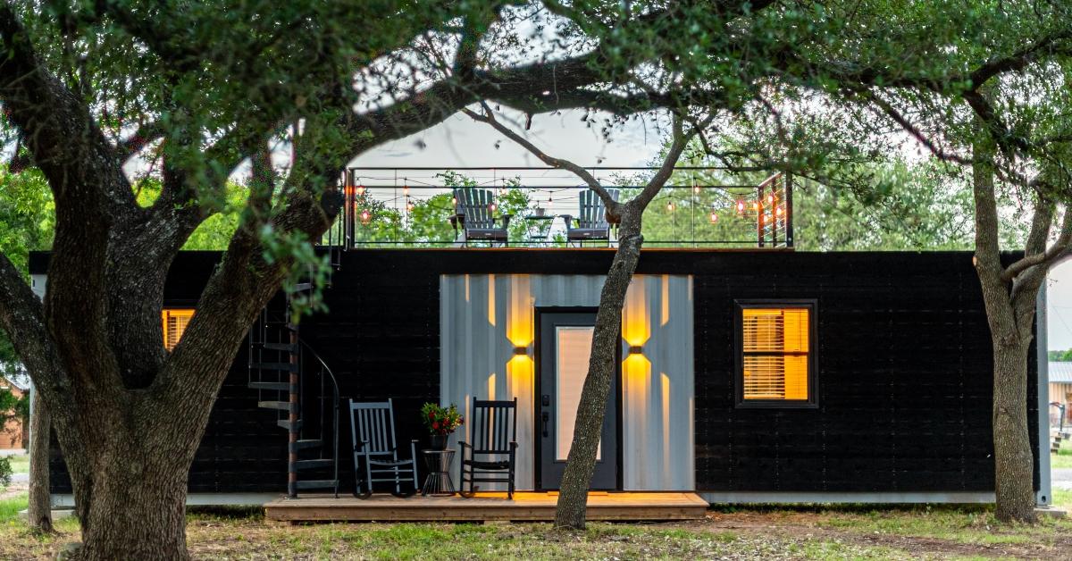 A tiny home located in the woods. 