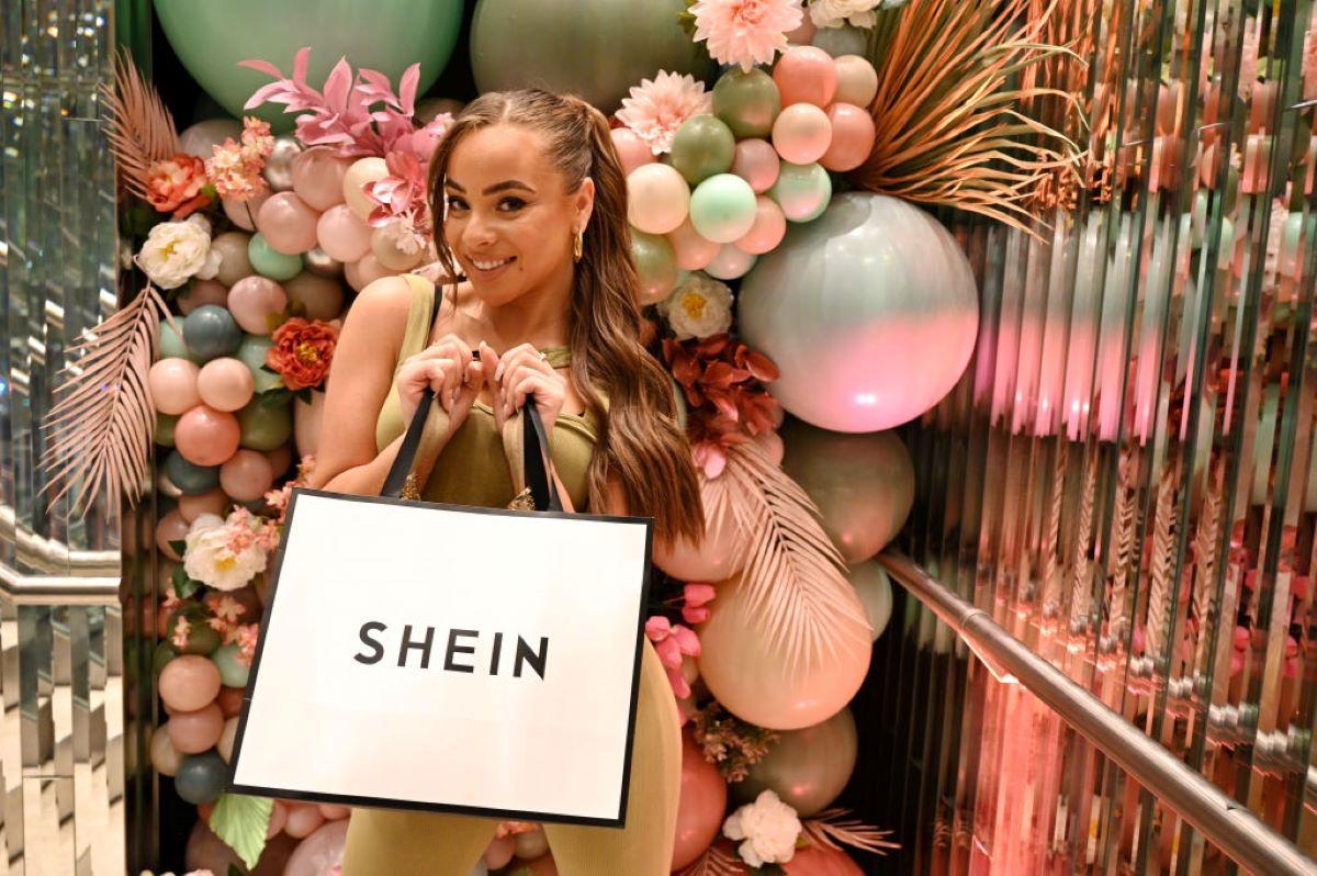 Danica Taylor holding a Shein shopping bag at a Shein pop-up shop in England.