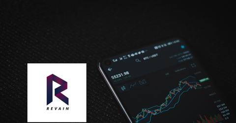 Crypto chart on a smartphone and Revain logo