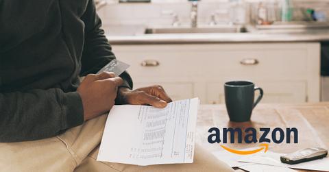 A person reading a credit card statement