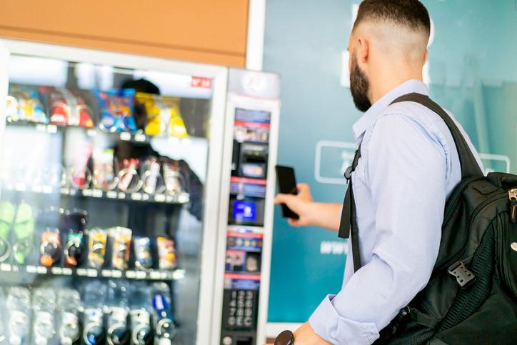 A man using a vending machine