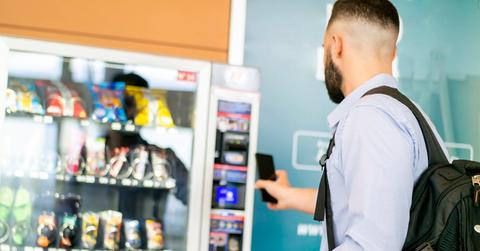 A man using a vending machine