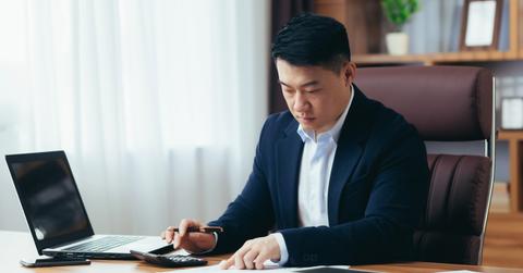 A man looking at debt payment methods