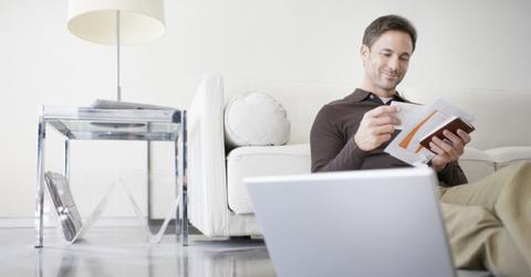 A man looking at 401(k) documents