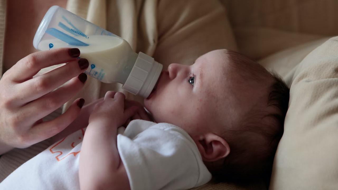 A baby drinking formula