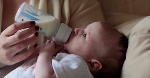 A baby drinking formula