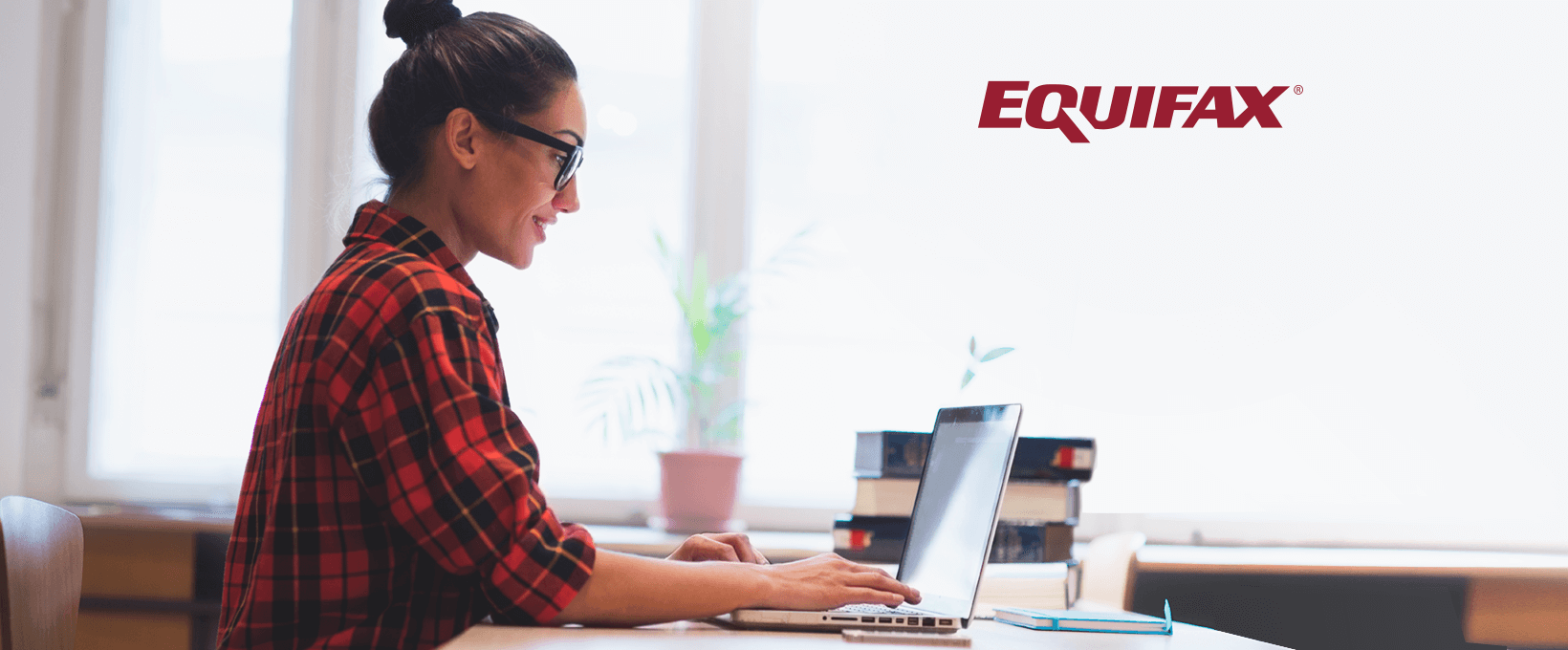 A woman typing on a laptop