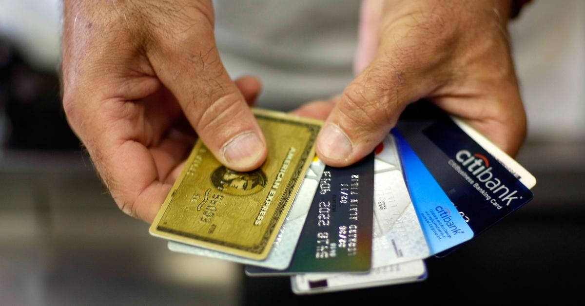 A person holding credit cards