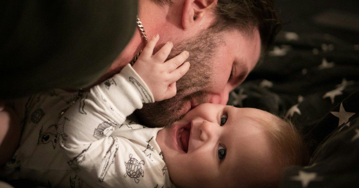 Dad playing with his young child.