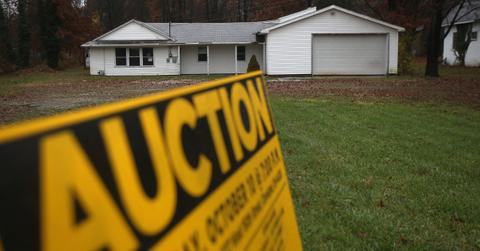 A house and an auction sign