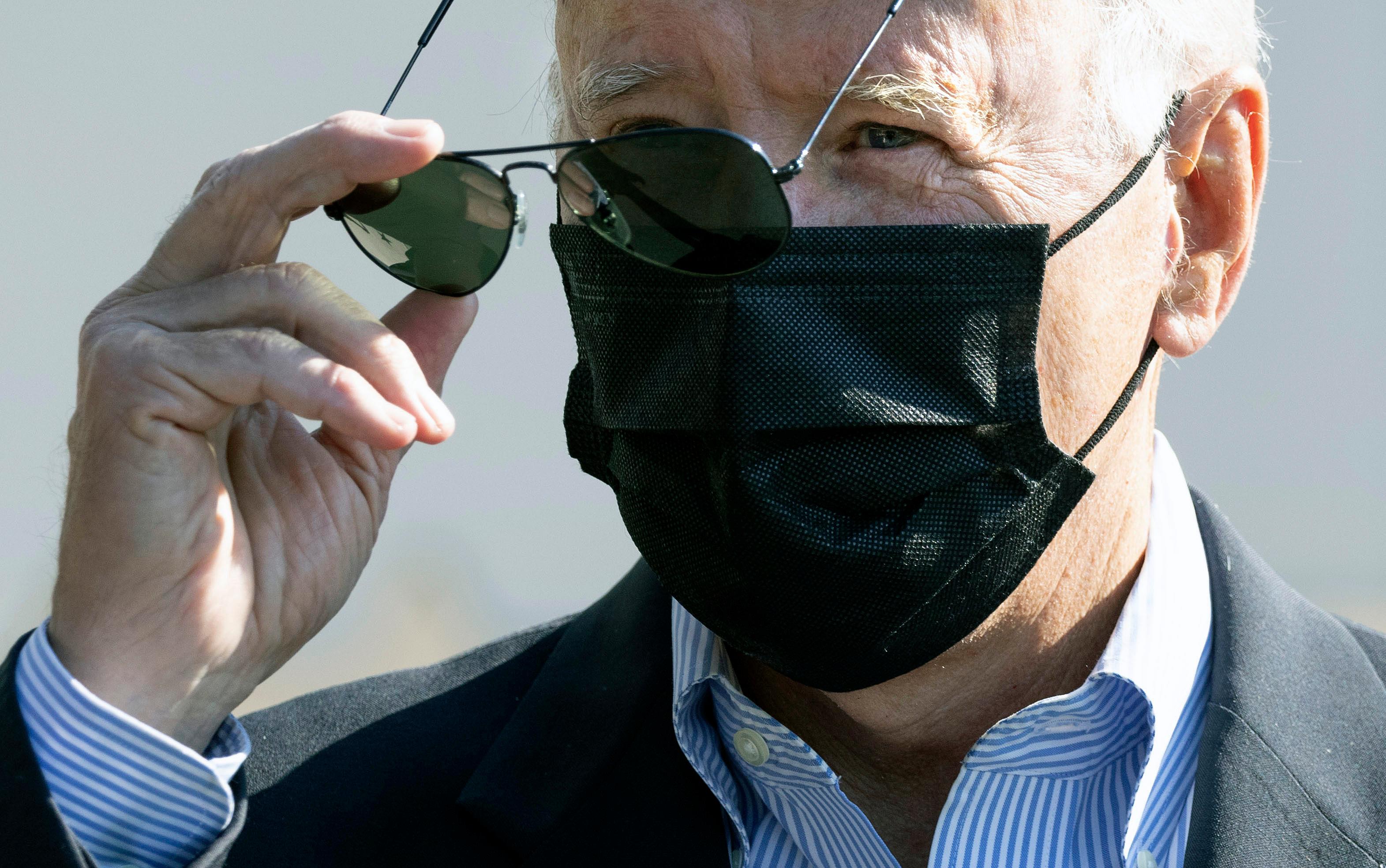 President Biden wearing mask and sunglasses