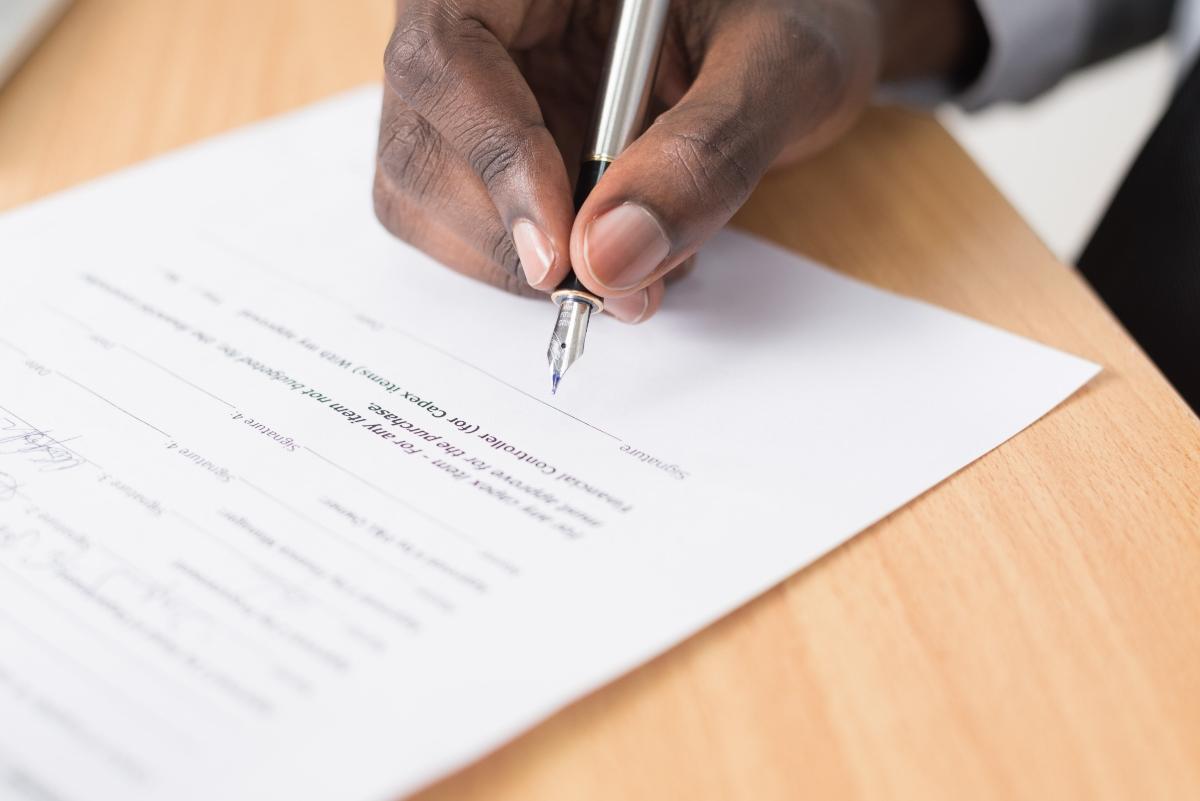 A person signing document