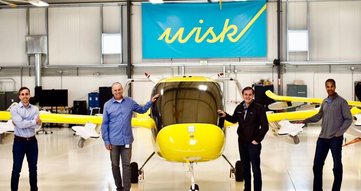 Wisk Aero employees with aircraft