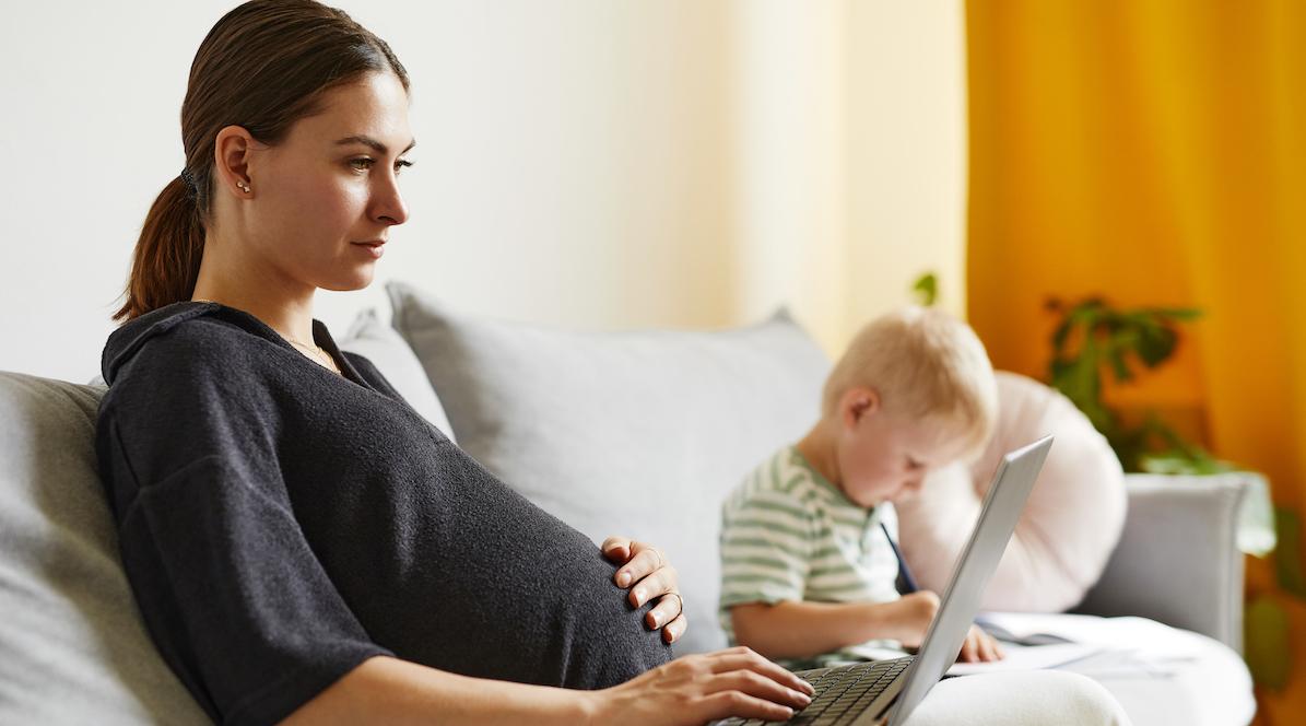 Pregnant woman working on computer