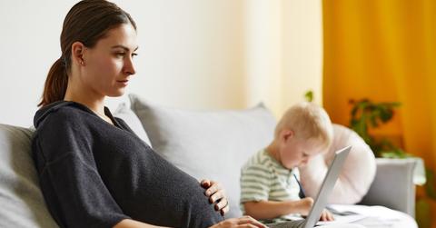 Pregnant woman working on computer