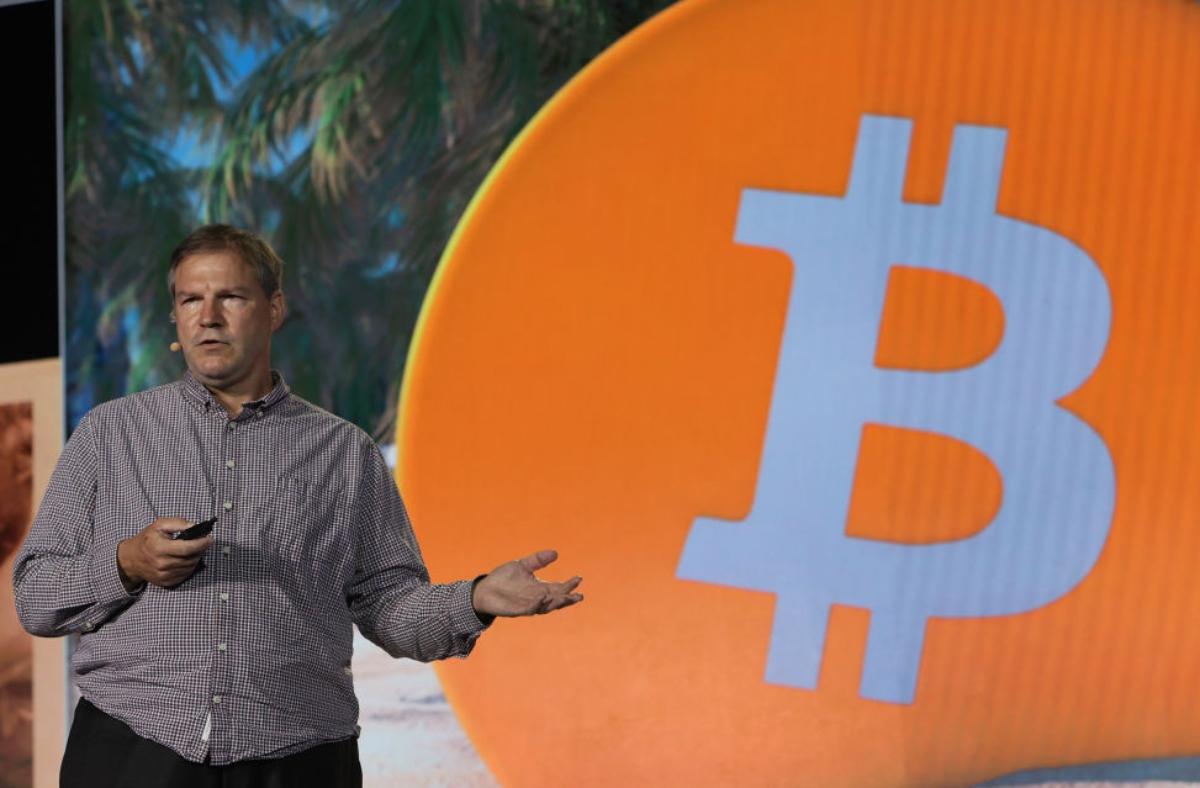 Nick Szabo and a Bitcoin sign