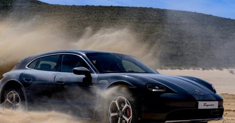 The Porsche Taycan driving on sand