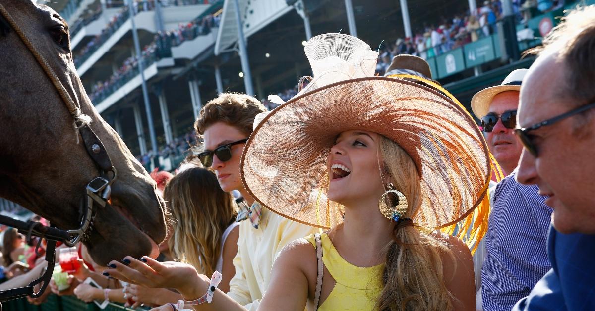 Guests engage with a Kentucky Derby horse at 142nd Kentucky Derby