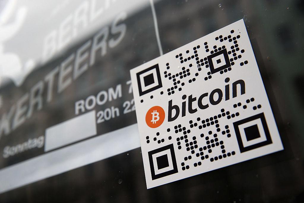 A sticker on the window of a local pub indicates the acceptance of Bitcoins for payment 