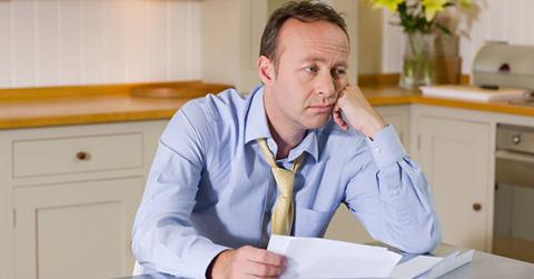 A man looking at medical bills