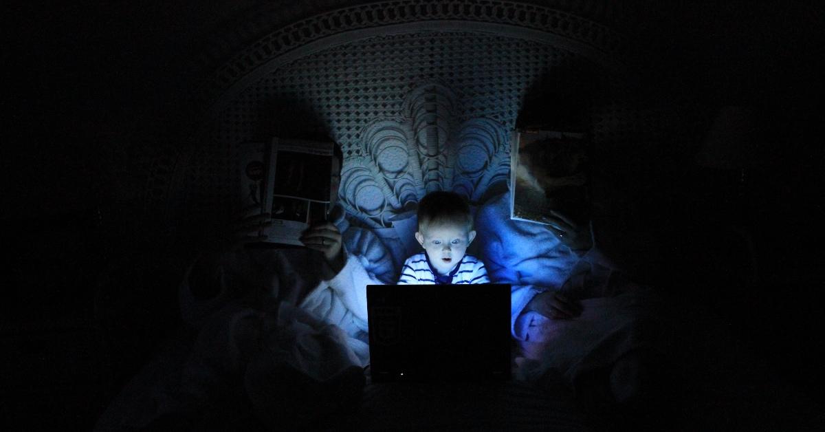 Small child playing on the computer 