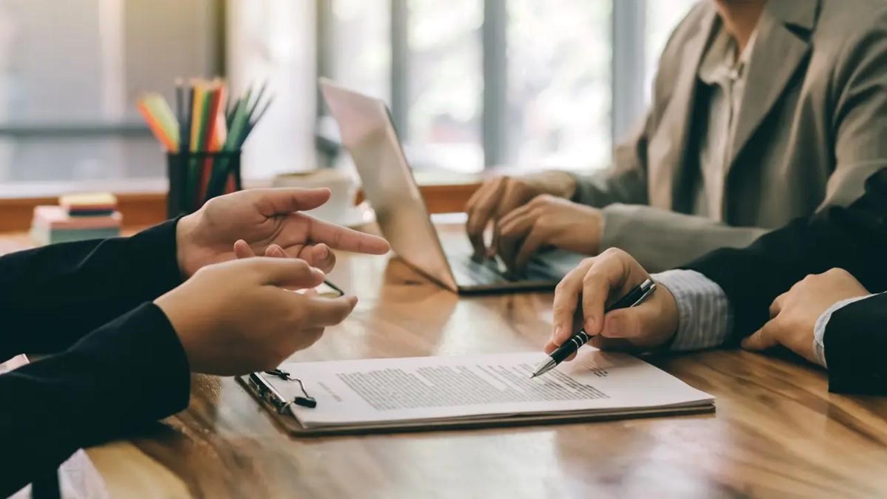 People discussing infinite banking before signing the paperwork