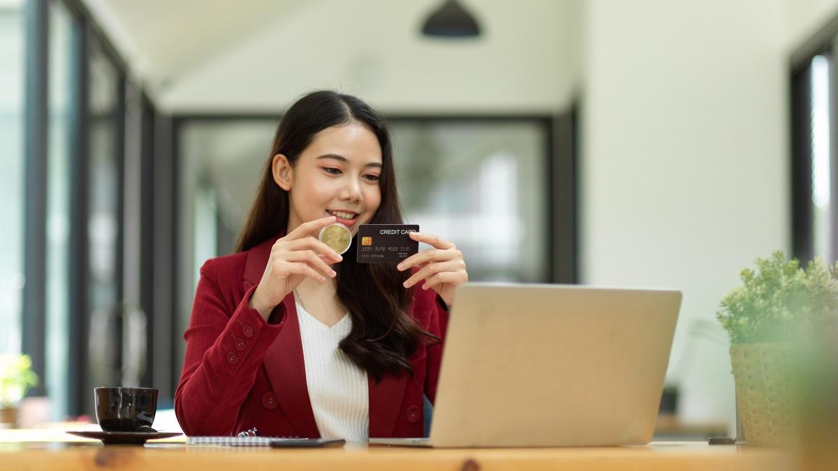 A woman using a crypto credit card