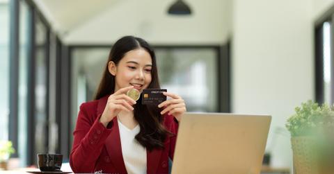 A woman using a crypto credit card