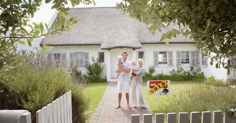 New homebuyers in front of their home