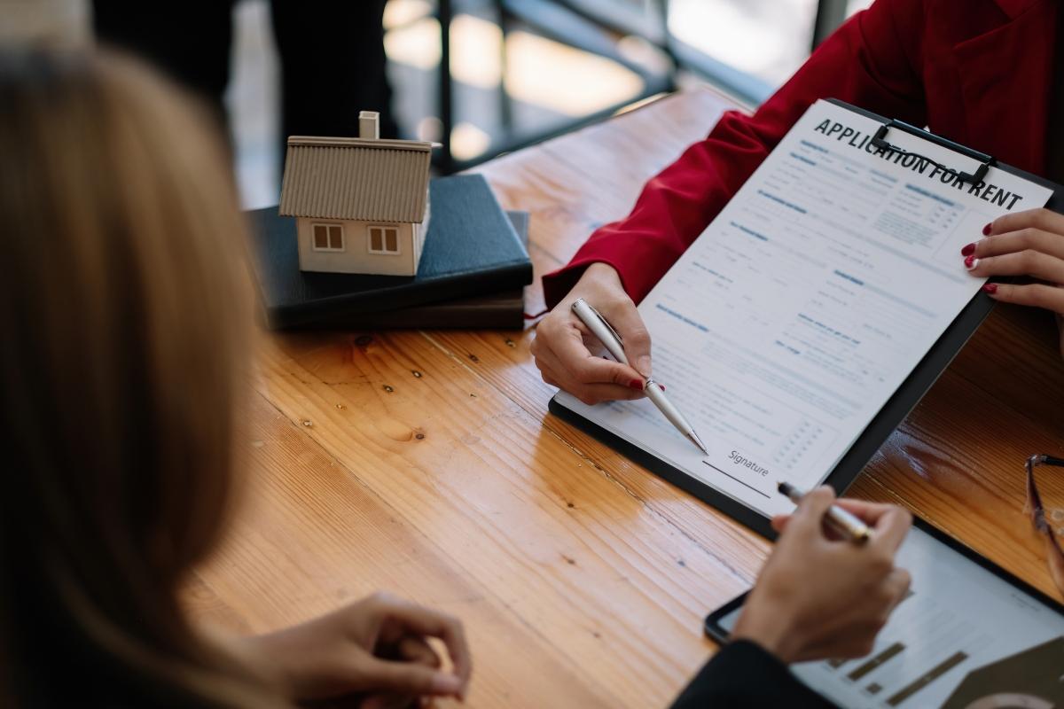 A person reading a rental application