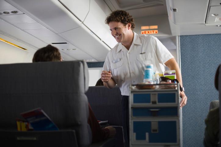 A flight attendant with in-flight refreshments