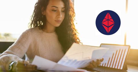 Woman looking at data and EthereumMax logo