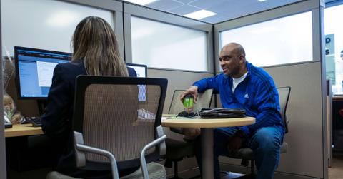 Two people working at a desk
