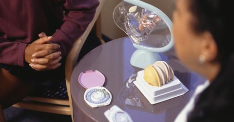 A woman talking to a doctor about contraceptives.