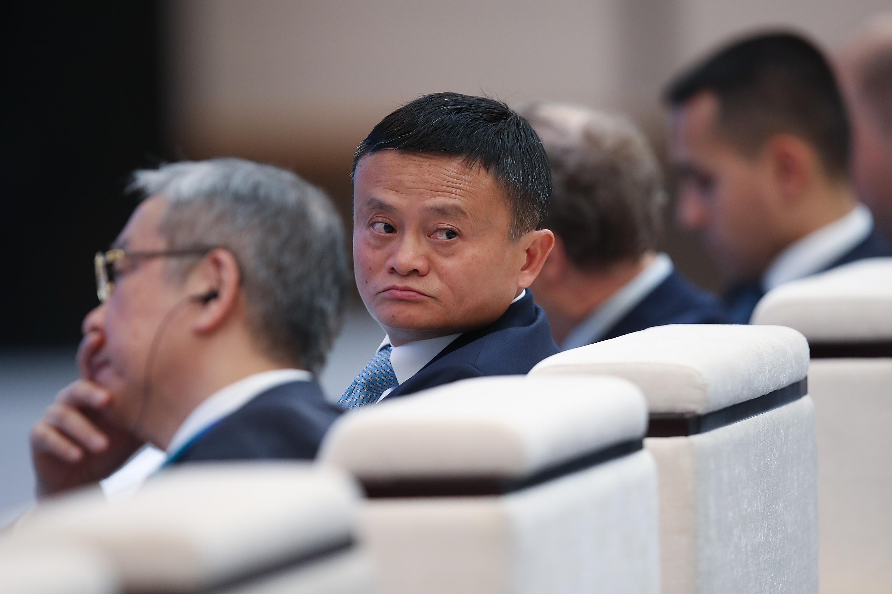 Jack Ma turning around sitting in chair