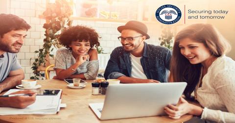 Group of people gathered around wooden table