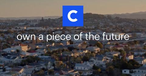 City view and Coinbase logo