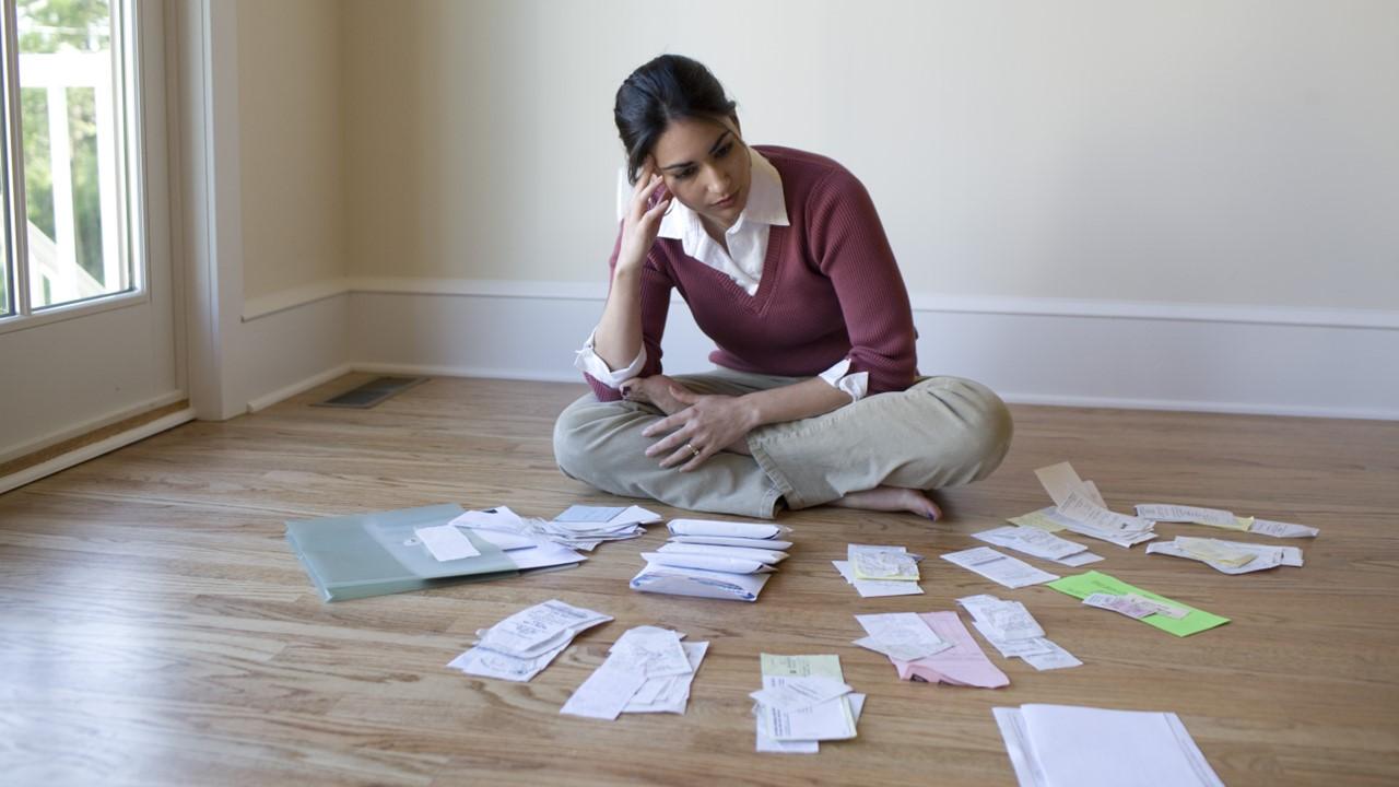 A woman looking at receipts for a tax audit