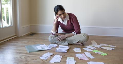 A woman looking at receipts for a tax audit