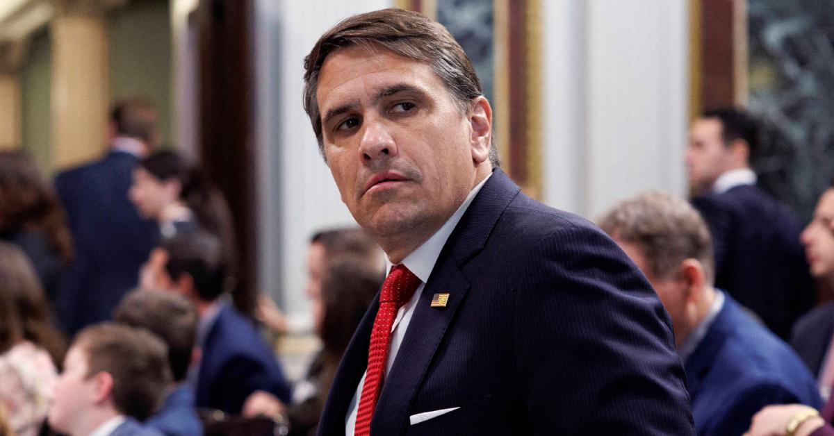 Todd Blanche wearing a blue suit at a political event.