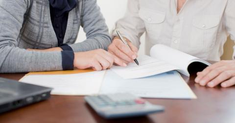 People discussing finances together such as dividend stocks