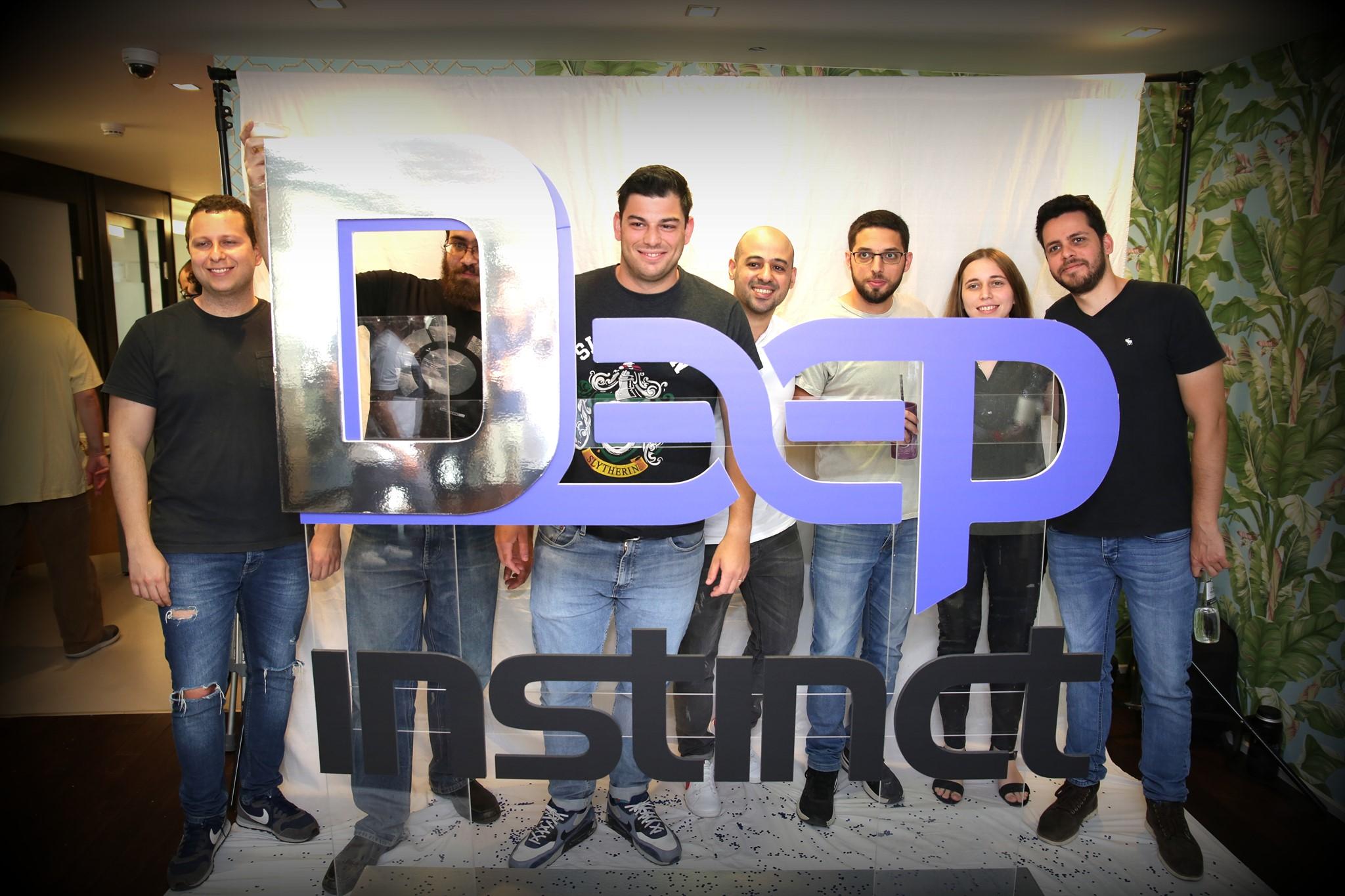 Deep Instinct company team members standing behind sign