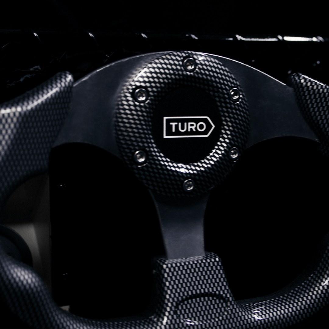 Steering wheel with Turo logo