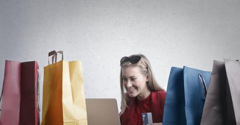 Happy woman shopping online at home