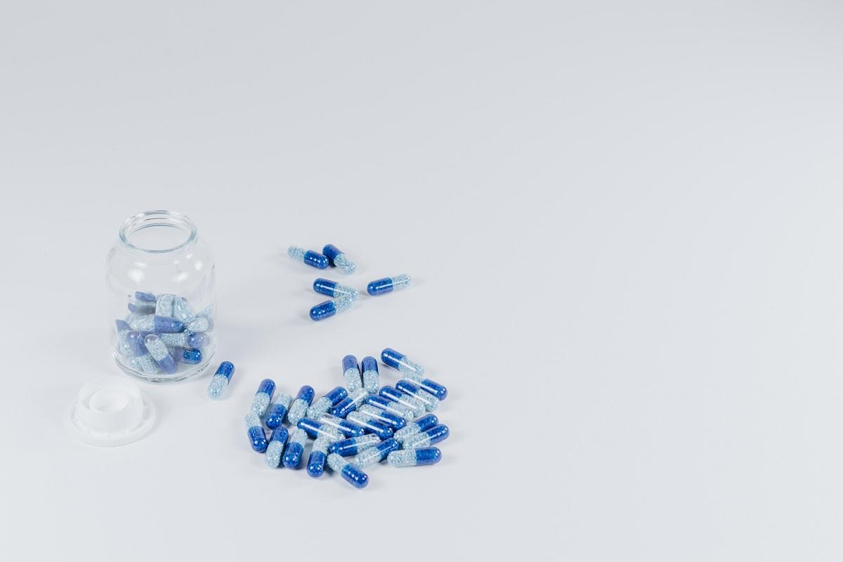 Blue pills on a white surface