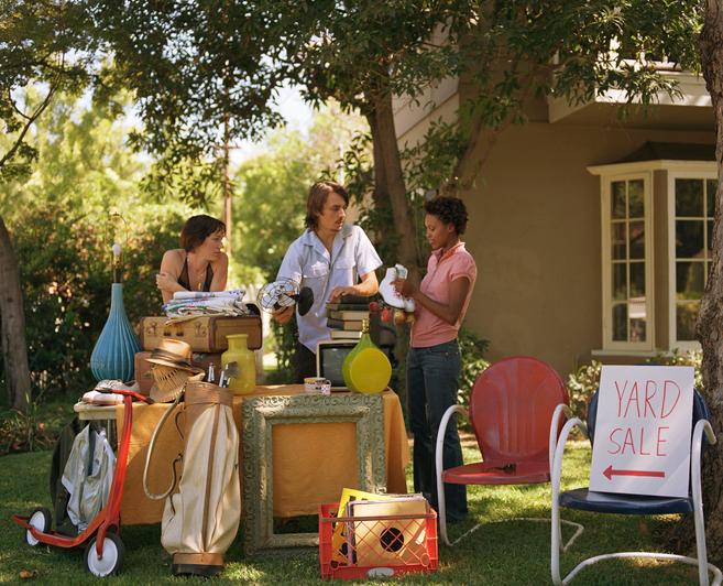 People selling items at a yard sale