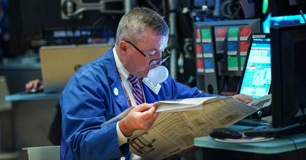 Trader looking at newspaper